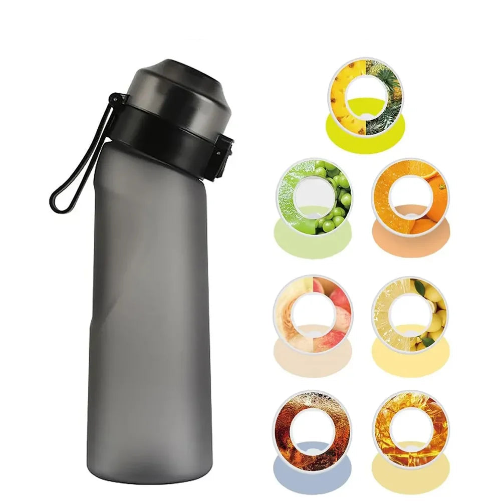 Gourde Air-gourde 650 ml en gris avec 7 capsules pour eau aromatisée sans sucre.