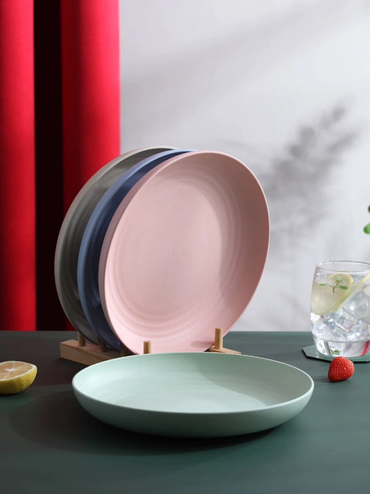 Assiettes rondes incassables en paille de blé dans des couleurs pastel, modernes et durables