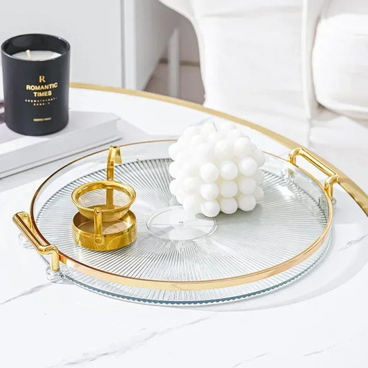 Plateau Rond Acrylique avec Poignées Dorées – Déco & Service. Plateau acrylique rond transparent avec poignées dorées et bougie