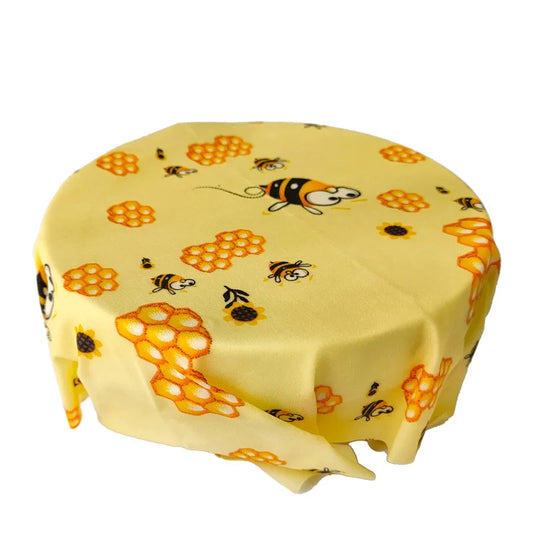 Ustensile de chef Wraps Alimentaires Réutilisables – Cire d’Abeille jaune motif abeilles et alvéoles couvrant un bol