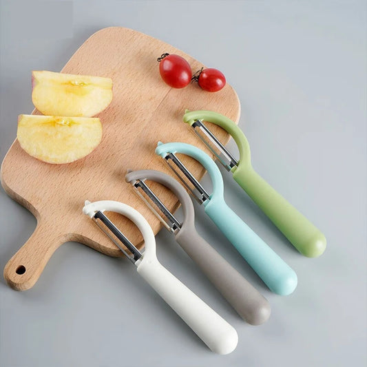 Éplucheur Inox Multifonction – Fruits Légumes Antidérapant en différents coloris avec pommes et tomates cerises
