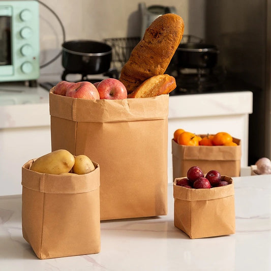 Sac Kraft Multi-Usage Étanche et Résistant – 1 à 30 pcs avec des fruits et pains sur une table de cuisine