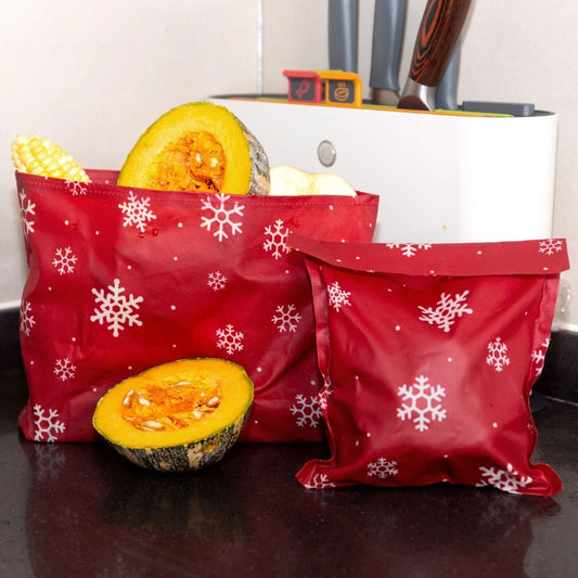 Sacs en cire d’abeille réutilisables pour conserver les aliments, design rouge avec flocons de neige.