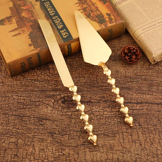 Set Couteau et Pelle à Gâteau Or – Élégant & Durable avec des manches en forme de cœur, parfait pour les occasions spéciales