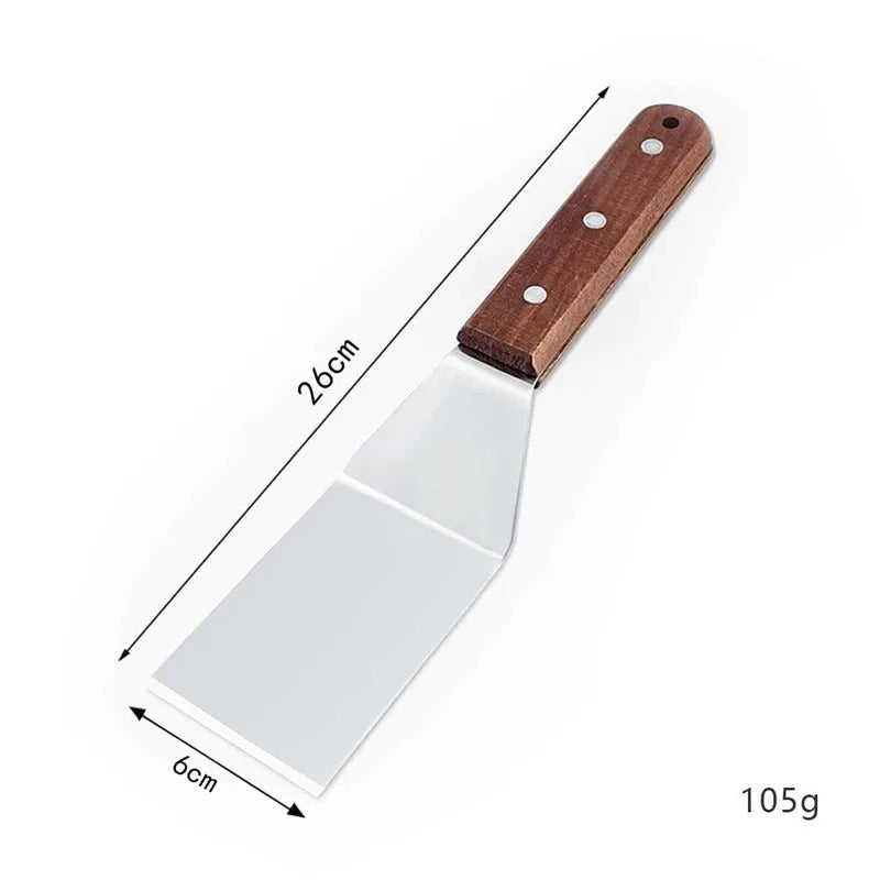 Spatule inox avec manche en bois de 26 cm, idéale pour cuisiner et servir vos plats.