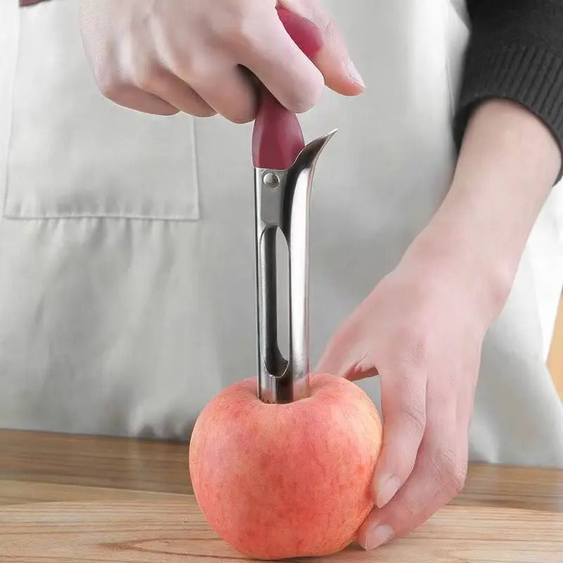 Vide-Pomme Inox Professionnel Évideur Fruits & Légumes en action sur une pomme rouge