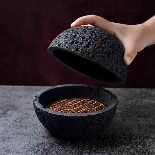 Bol créatif noir style pierre volcanique, design rond élégant

