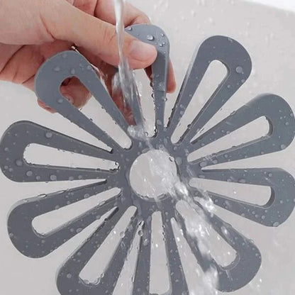 Dessous-de-plat silicone résistant à la chaleur en forme de fleur, idéal pour protéger vos surfaces