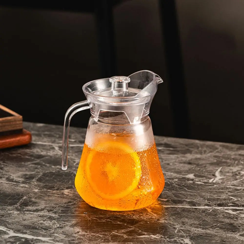Pichet à Eau en Acrylique Résistant Chaud Froid avec tranches d'orange sur une table en marbre