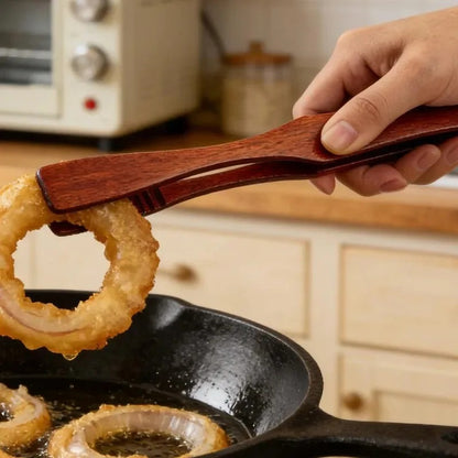 Pince alimentaire en bois 27 cm multifonction utilisée pour saisir des aliments frits dans une poêle