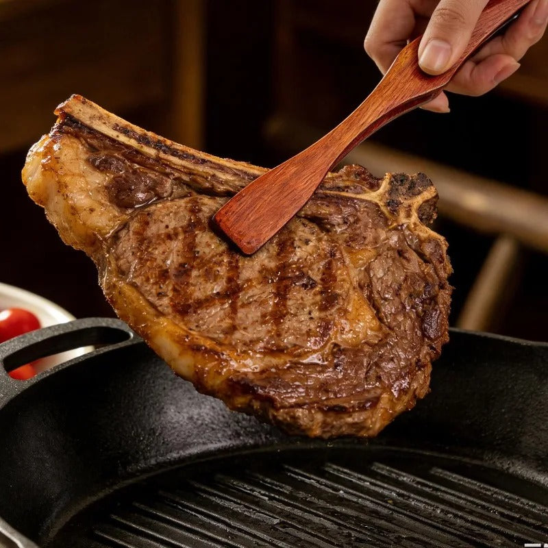 Pince alimentaire en bois 27 cm multifonction utilisée pour retourner une viande sur le grill