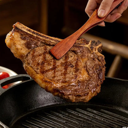 Pince alimentaire en bois 27 cm multifonction utilisée pour retourner une viande sur le grill