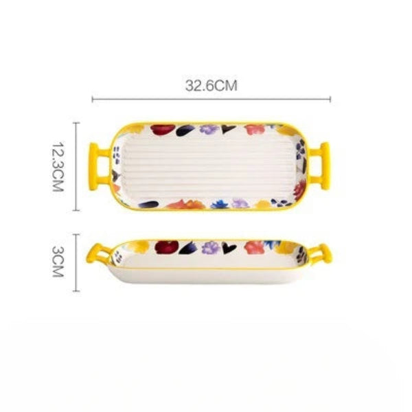 Plat de cuisson en céramique rectangulaire avec des poignées jaunes et motifs colorés