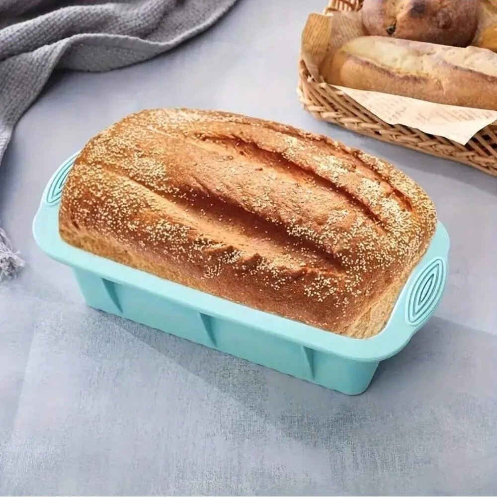 Moules Gâteaux Silicone Variés – Cuisson Facile moule à pain bleu avec pain cuit dessus posé sur table grise