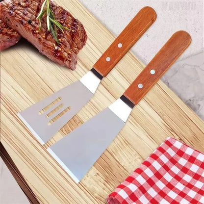Spatule inox avec manche en bois pour griller, idéale pour cuisiner viandes et légumes